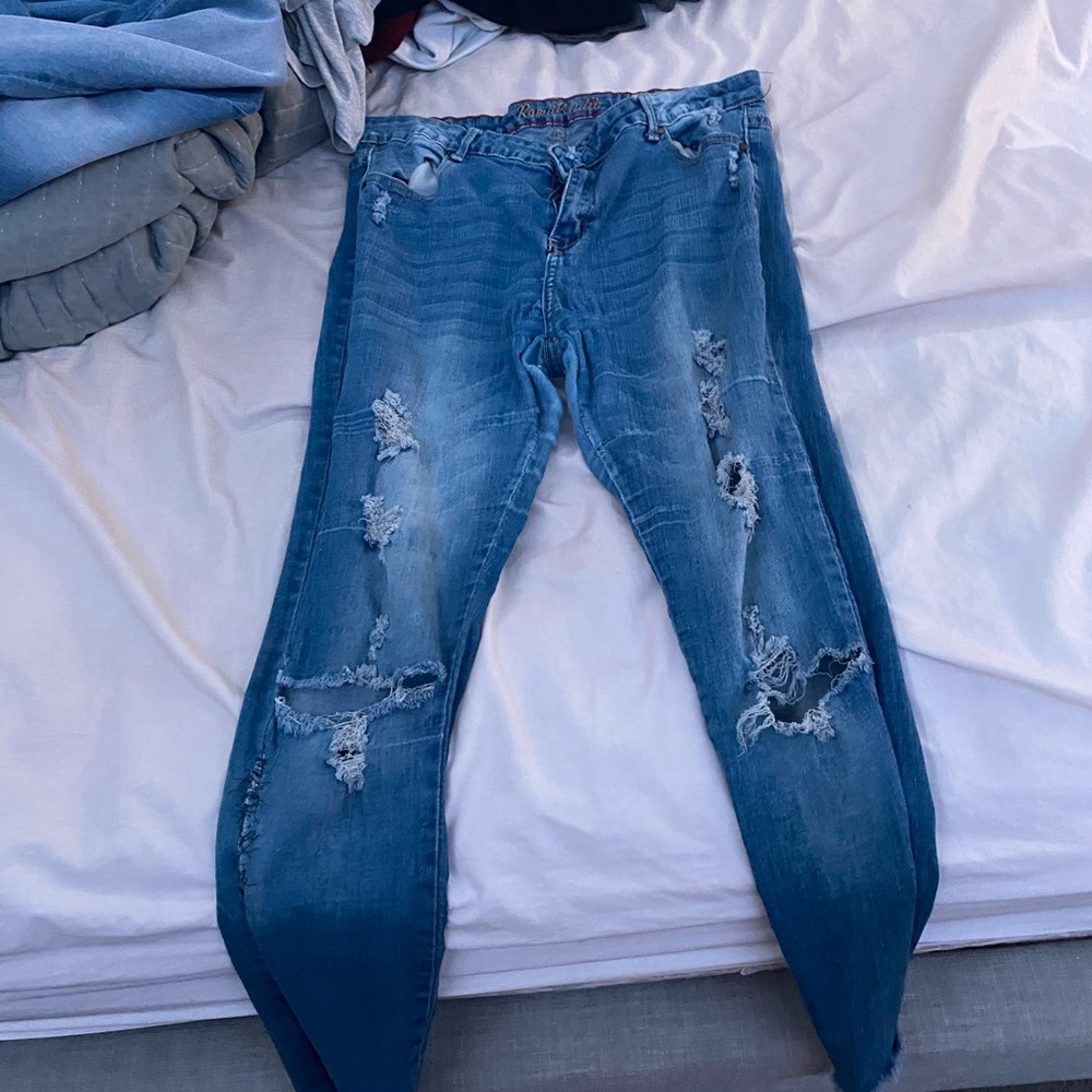 lightish blue denim distressed jeans